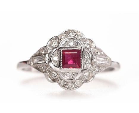 ART DECO STYLE RUBY AND DIAMOND DRESS RINGthe pierced bezel with central square step cut ruby 3.4mm across within a quatrefoi