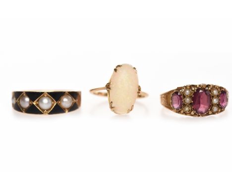 THREE VARIOUS DRESS RINGScomprising a Victorian fifteen carat gold garnet and seed pearl ring with an engraved shank and scro