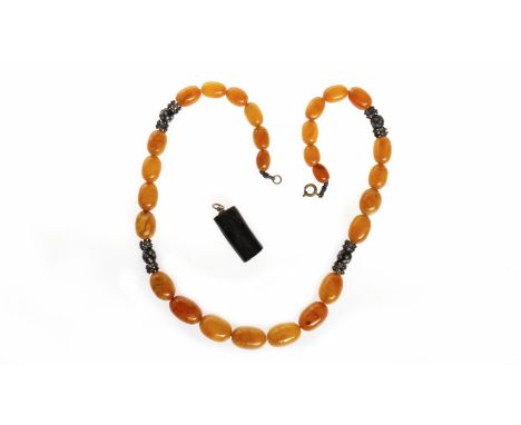 CERTIFICATED AMBER NECKLACEformed by graduated ovoid beads, the largest bead 17.8mm long, the smallest bead 10.5mm long, with