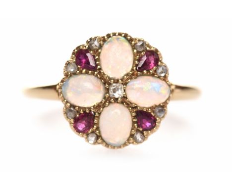 RUBY AND OPAL DRESS RINGthe round bezel grain set with four cabochon opals interspaced by pear shaped rubies, with diamonds t