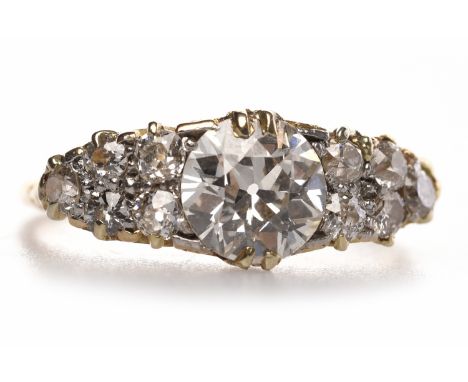 IMPRESSIVE VICTORIAN STYLE DIAMOND DRESS RINGset with a central old cut diamond of approximately 1.29 carats with a further f