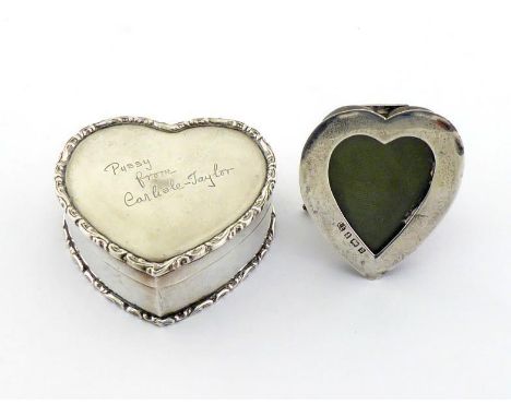 A small Edwardian silver heart-shaped photograph frame by Lawrence Emanuel, Birmingham, 1901, 5 cm. high, with silver strut t