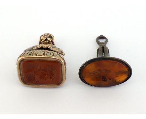 A brass oval fob seal, late 18th century, the carnelian matrix with intaglio profile of a lady; also a pinchbeck oblong fob s