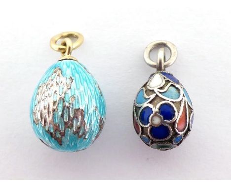 Two Russian egg charms, including a gold and guilloche enamel example, the suspension loop stamped '56', 20mm long, 3.2gms, a