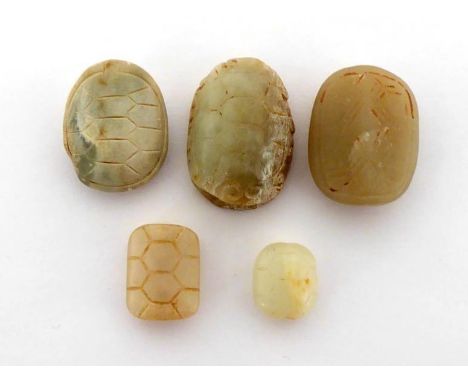 A group of five Chinese jade carved attachments in the form of turtle carapaces, jade in pale white and celadon colour with b