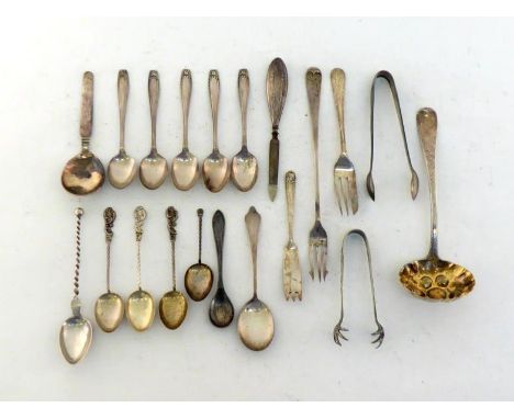 A Victorian silver "berry" sugar sifter spoon, London, 1847; a silver pickle fork; five silver coffee spoons with matching to