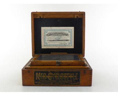 An early Gestetner duplicating machine complete with plates, pen, roller, ink, correcting fluid and sheets of prepared paper,