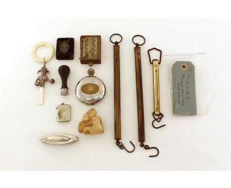 A mixed lot, including a silver nail buffer, plated jester teething ring , a plated vesta, a Dalvey quartz traveller’s clock,