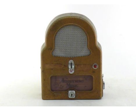 A coin-in-the-slot electrical extension music player in gold finished cast alloy case with back lit "Melodyvend Music" panel,