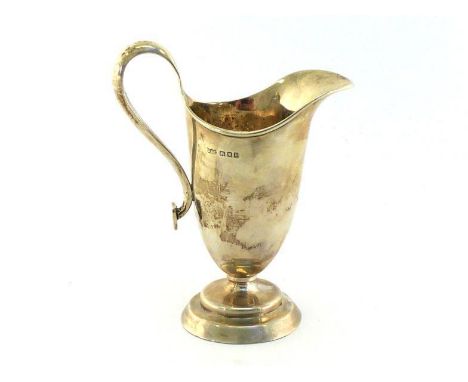 A silver helmet cream jug, possibly by D. G. Collins, London, 1919, on stepped circular pedestal foot, the loop handle termin