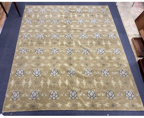 An Arts and Crafts style pale green ground carpet, 300 x 250cm