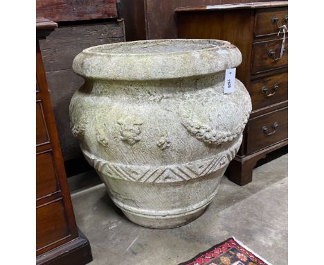 A large circular reconstituted stone garden planter, diameter 66cm, height 66cm