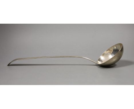 A George III Irish silver soup ladle, with bright cut and crested handle, Dublin 1809, 5.5oz