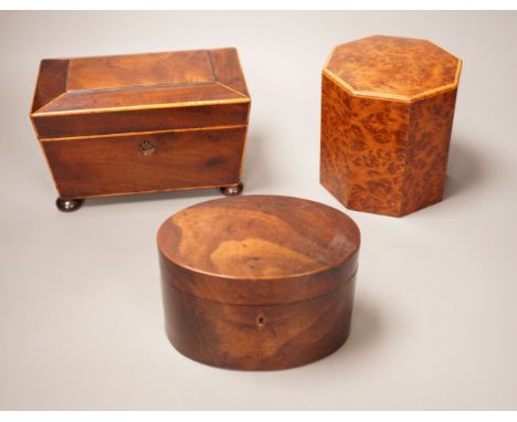 An oval mahogany box (with key), an octagonal amboyna  tea caddy and a boxwood edged mahogany tea caddy, 19th century 20cm wi