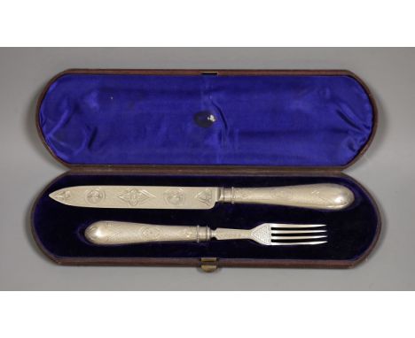 A Victorian cased silver knife and fork serving set, Birmingham 1863, handles loaded
