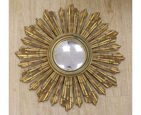 A gilt wood sunburst convex wall mirror, 64cm