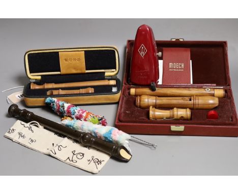 Two cased recorders, one other and a metronome etc