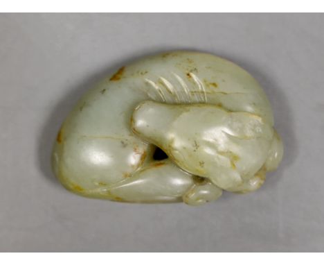A Chinese jade carving of a sleeping dog, 6cm wide