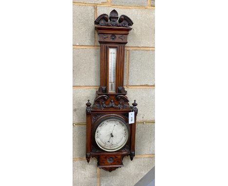 A late Victorian carved walnut aneroid barometer and thermometer, height 95cm