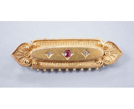 An Edwardian gold brooch, set with a ruby and two diamonds, 4.5cm gross 6.2 grams (a.f.)