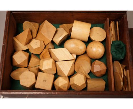 A mahogany cased set, Edwards Geometrical Planes and Solids': 19th century educational carved wooden geometry instructional s