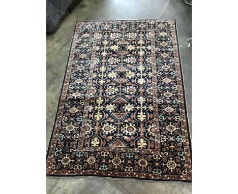 A Caucasian design blue ground carpet, 252 x 170cm