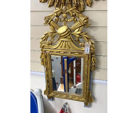 A Continental carved giltwood wall mirror, width 44cm, height 80cm