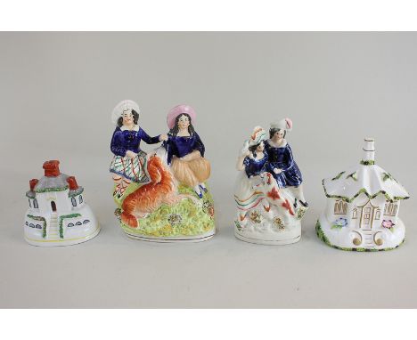A Coalport 'Gate House' pastille burner, a Staffordshire pottery figure group of a man, woman and dog, a Staffordshire potter