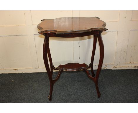 A serpentine shaped mahogany side table on cabriole legs, with undershelf, 62cm