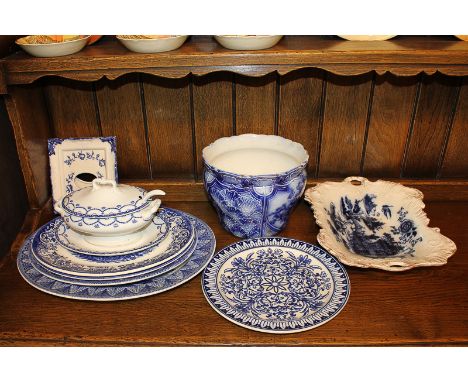 A collection of Victorian and later blue and white pottery to include a Grimwades jardiniere, a Cheltenham sauce tureen and l