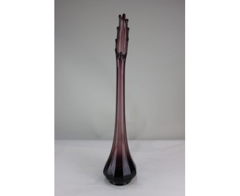 A vintage amethyst tall glass vase, faceted tapering form on circular foot, 67cm high