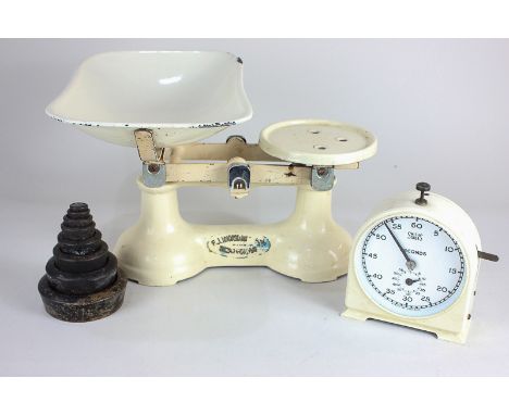 A set of cream enamel metal kitchen scales with weights, 26cm, and a Smiths stop clock 