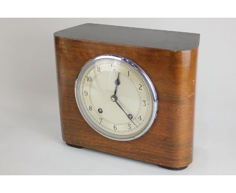 An Art Deco style walnut mantel clock, Westminster chiming movement, by Garrard, 27cm