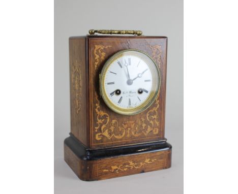 A late 19th century French mantel clock in marquetry inlaid rosewood case, the dial signed Hry Marc, Paris (some damage), 24c