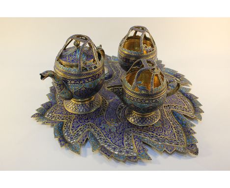 An Indian brass and enamel three piece tea set on tray, with two-tone blue floral design, the tray with pierced decoration an