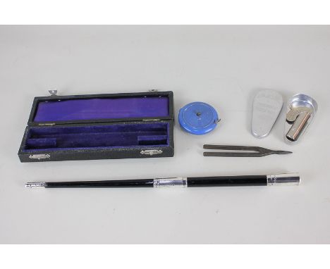 An Elizabeth II silver mounted ebony conductor's baton, maker FD, London 1958, in case, together with a Metzler & Co Ltd Old 