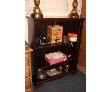 A mahogany bookcase with two adjustable shelves, on bracket base (incomplete number of shelf clips), 84cm