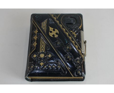 A Victorian photograph album of black and gilt design, containing thirty-two portrait and full length photographs of men, wom