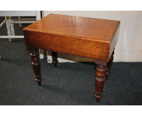A 19th century ceramic baby bath in fitted rectangular stand with cover, on turned legs