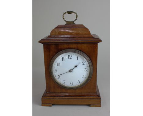 A Georgian style mahogany cased mantel clock with Arabic numerals, the movement marked Made in France, 22cm high