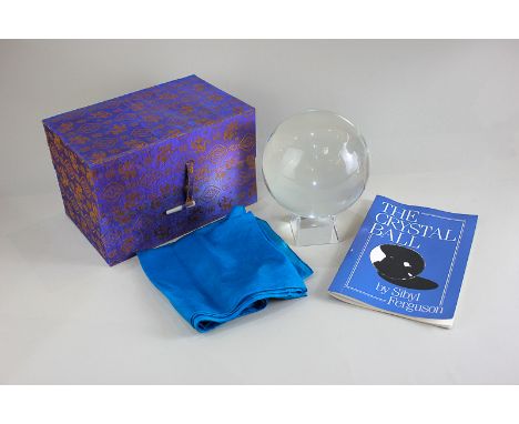 A crystal ball and stand in box, together with Ferguson, Sibyl, The Crystal Ball, published Samuel Weiser 1979, and a blue si