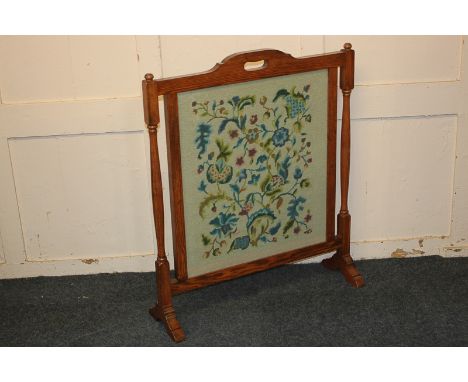 An early 20th century oak framed tapestry fire screen, 68cm
