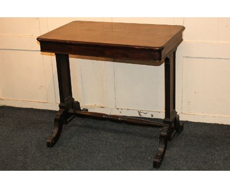 A Victorian mahogany rectangular side table with twin end supports and four fluted legs with turned uniting stretcher (a/f), 