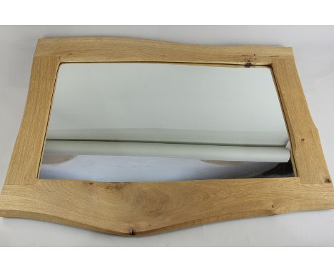 A rustic wooden framed wall mirror, wired for hanging portrait or landscape, mirror plate 59cm by 35cm