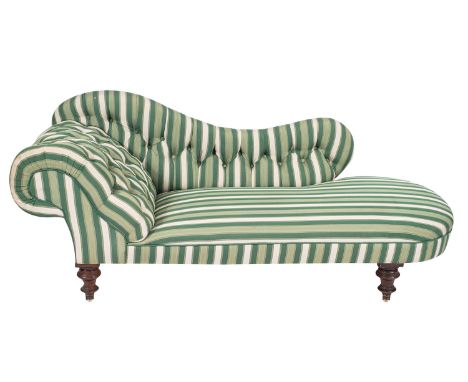A Victorian walnut and button upholstered chaise longue, third quarter 19th century; later green and white stripe upholstered