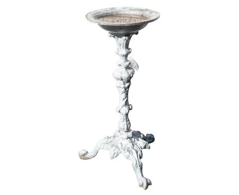 A painted cast iron bird bath, early 20th century; in Rococo revival taste, the basin atop a rocaille foliate cast shaft risi