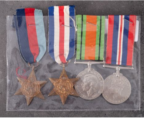 A WWII group of four comprising 1939-45 Star, France & Germany Star, War Medal and Defense Medal, together with manuscript no