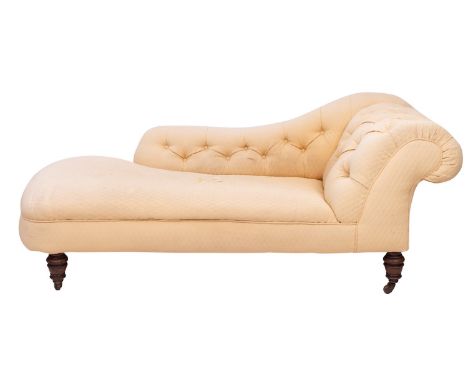 A Victorian button upholstered chaise longue, third quarter 19th century; with outscrolled side and low three-quarter length 