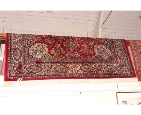 Keshan carpet with a red ground 3.50 x 2.50