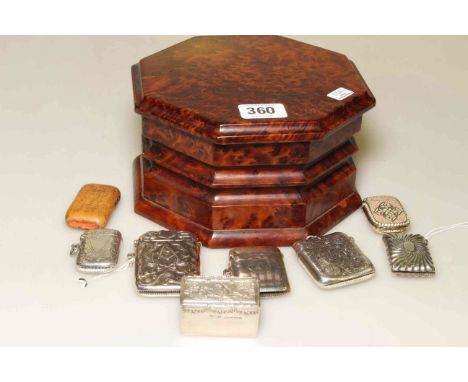 Collection of vestas and trinket boxes, some silver, one with Masonic emblem, in a burr yew box